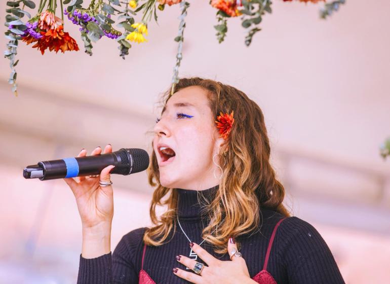 A woman singing into a microphone