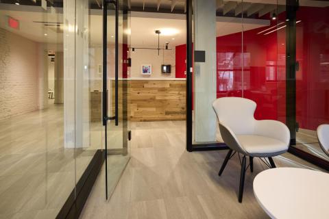 Room at 12 Hemenway with seating and glass wall