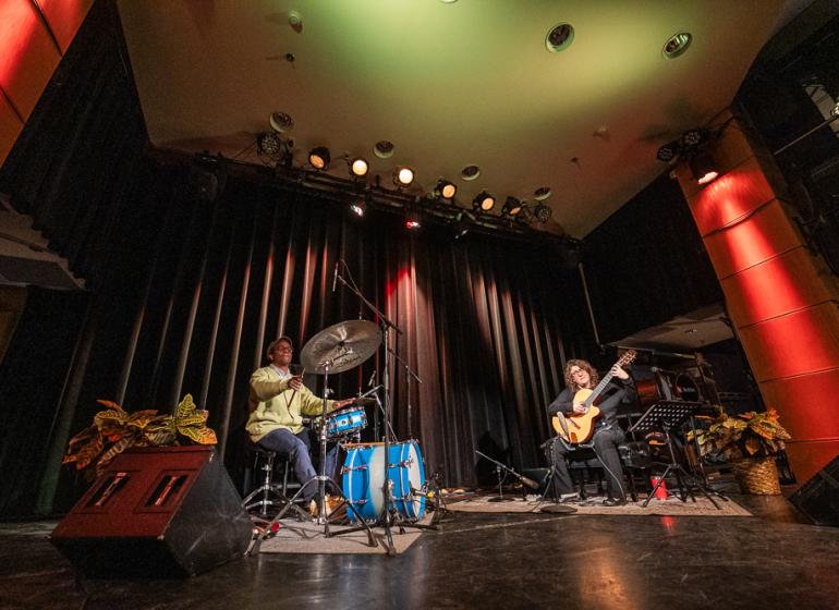 Francisco Mela and Kim Perlak performing on stage