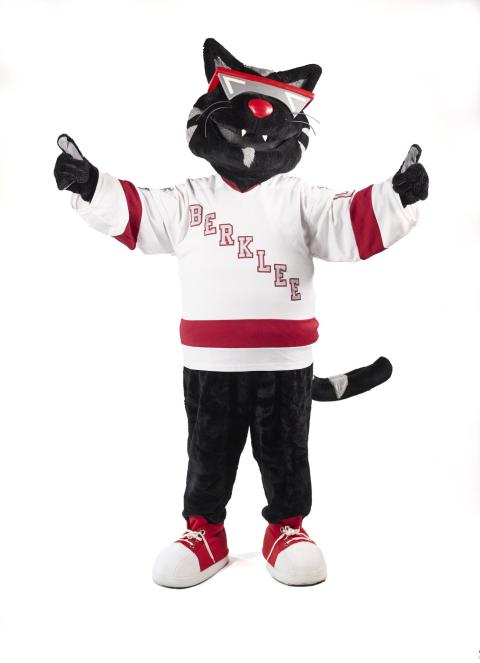 Mingus poses in his Berklee hockey jersey