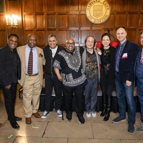 A group of employees smiles together at the annual service recognition event