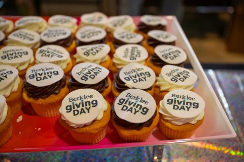 A plate of cupcakes decorated with the Berklee Giving Day branding.