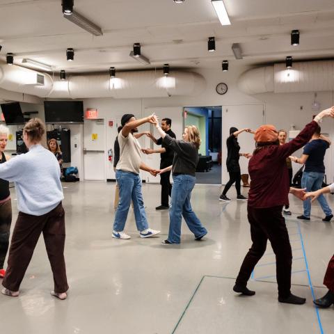 Faculty members learn a dance during a BTOT session