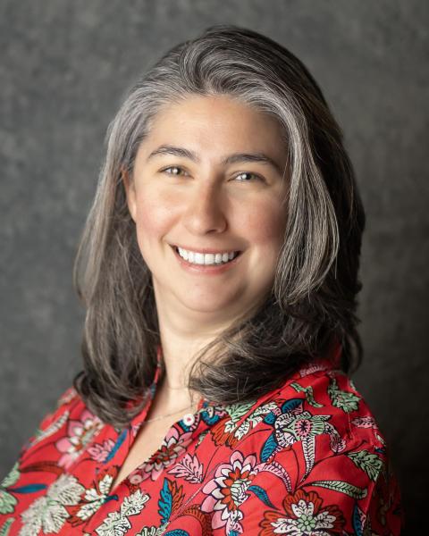 Professional head shot of Alyssa, smiling.