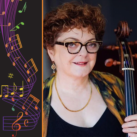 Phoebe Carrai holds a string instrument and smiles 