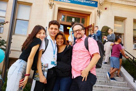 Family hugging outside 8 Fenway