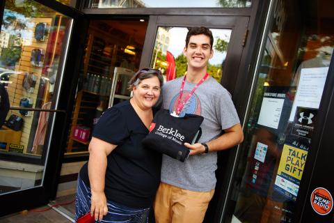 family standing in front of the Berklee Bookstore