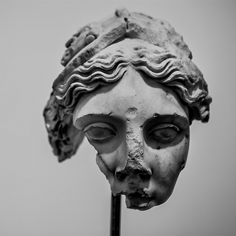 a broken greek goddess sculpture 