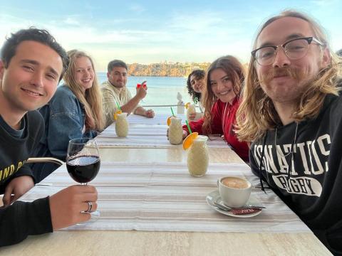 Kirsten Kirk having dinner with friends near the beach.