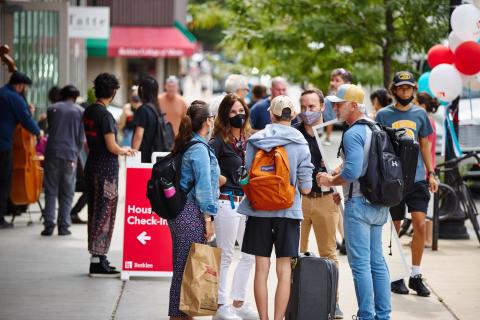 Family talking with members of Berklee staff