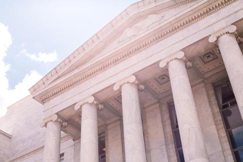 a photo of a government building with columns in the daytime