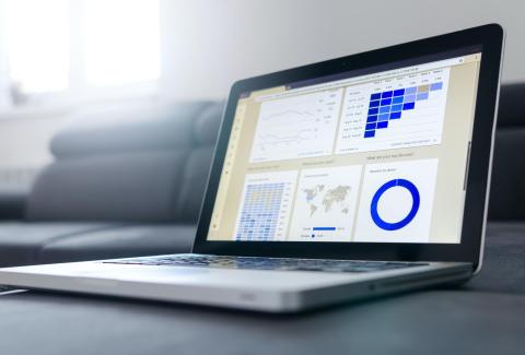 Image of a laptop showing a data dashboard.