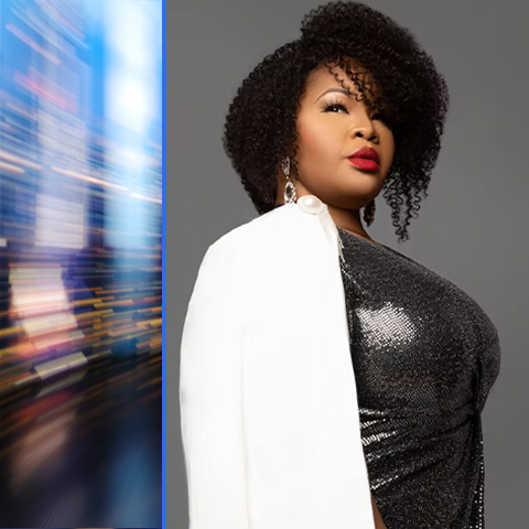 Karen Slack header: posing in a black dress with a white coat