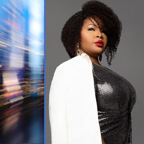 Karen Slack header: posing in a black dress with a white coat