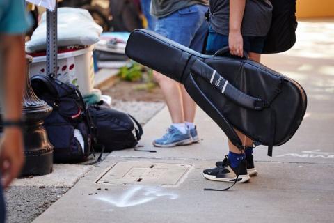 a photo of someone holding a guitar