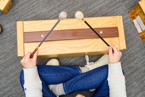 child in music class