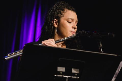 elena pinderhughes onstage playing the flute