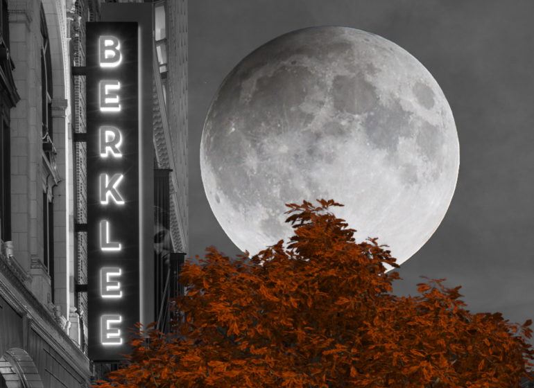 A black and white image of the Berklee marquee sign with a full moon in the background and a red tree in the foreground