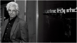 john storyk standing in front of the entrance to electric lady studios